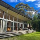The Architect-designed house opens onto a private natural bush amphitheatre.